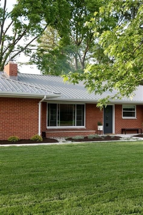 charcoal metal roof on red brick house with blue siding|25+ Stunning Red Brick and Siding Color Combinations .